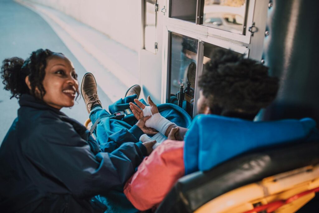 Emergency nurse assisting injured guy